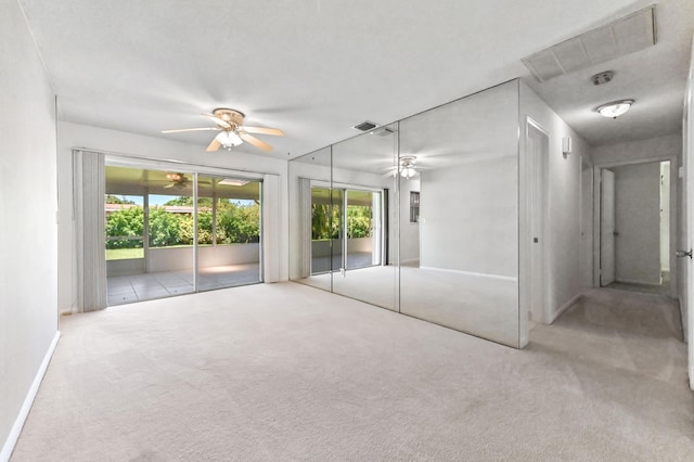 436 Santa Anna Dr, Palm Springs, FL 33461 - unfurnished bedroom featuring carpet floors, access to outside, multiple windows, and a ceiling fan