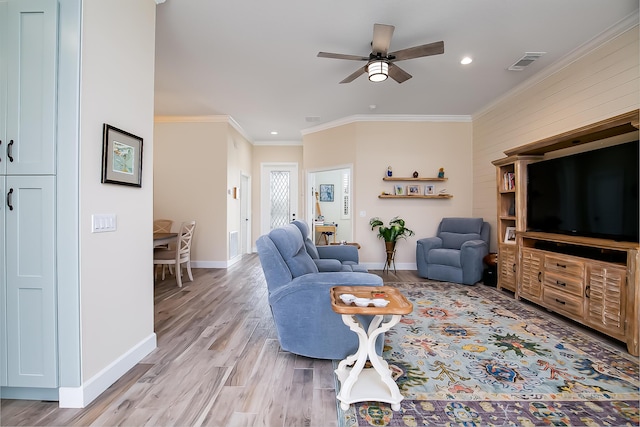424 NE Leaping Frog Way, Port Saint Lucie, FL 34983 - living area with a ceiling fan, crown molding, baseboards, light wood-type flooring, and recessed lighting
