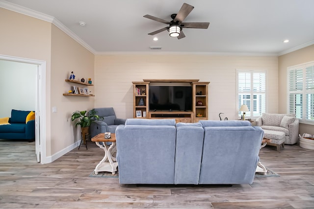 424 NE Leaping Frog Way, Port Saint Lucie, FL 34983 - living room with crown molding, wood finished floors, ceiling fan, baseboards, and recessed lighting
