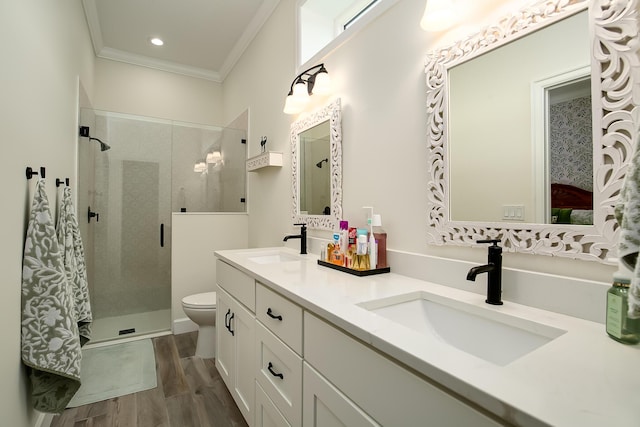 424 NE Leaping Frog Way, Port Saint Lucie, FL 34983 - full bath featuring crown molding, a shower stall, double vanity, wood finished floors, and toilet
