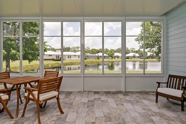 424 NE Leaping Frog Way, Port Saint Lucie, FL 34983 - sunroom featuring a water view and a residential view