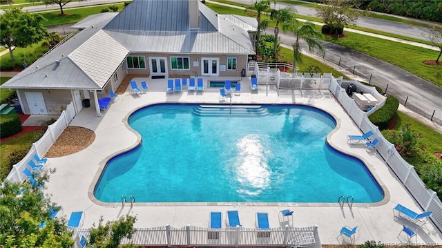 424 NE Leaping Frog Way, Port Saint Lucie, FL 34983 - view of pool with a fenced backyard, a patio, and french doors