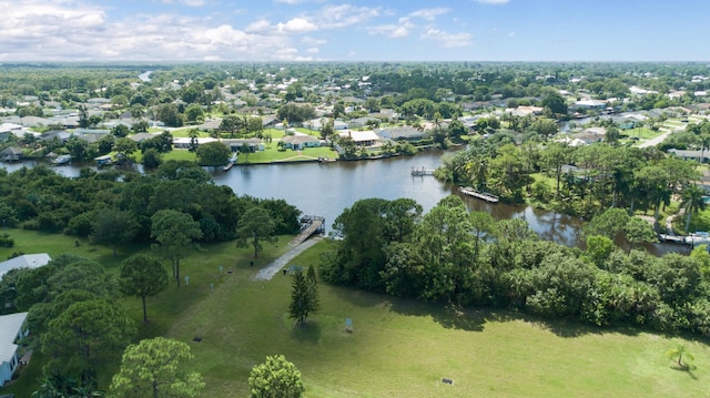 424 NE Leaping Frog Way, Port Saint Lucie, FL 34983 - aerial overview of property's location featuring a large body of water, a tree filled landscape, and nearby suburban area