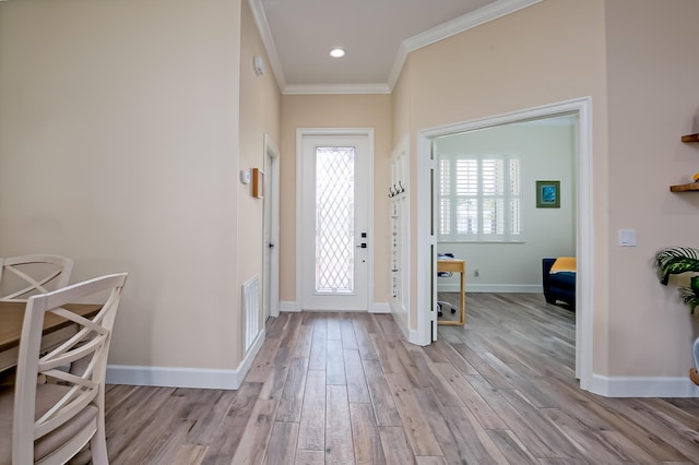 424 NE Leaping Frog Way, Port Saint Lucie, FL 34983 - entrance foyer featuring ornamental molding, light wood-style floors, and baseboards