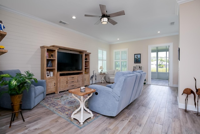 424 NE Leaping Frog Way, Port Saint Lucie, FL 34983 - living room with light wood-type flooring, ceiling fan, recessed lighting, baseboards, and ornamental molding