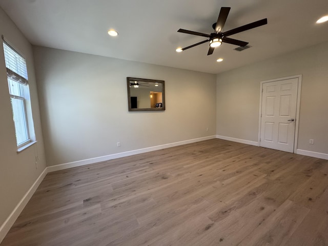 2799 Saranac Ave, West Palm Beach, FL 33409 - empty room with healthy amount of natural light, wood finished floors, recessed lighting, and ceiling fan