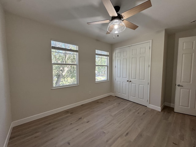2799 Saranac Ave, West Palm Beach, FL 33409 - unfurnished bedroom featuring light wood-type flooring, a closet, and a ceiling fan