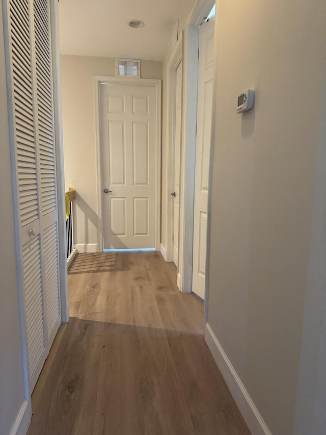 2799 Saranac Ave, West Palm Beach, FL 33409 - corridor featuring wood finished floors and baseboards