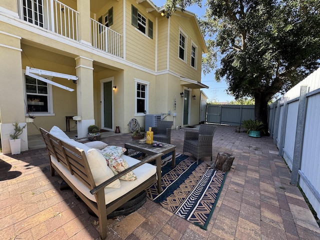 2799 Saranac Ave, West Palm Beach, FL 33409 - fenced backyard with a patio area, outdoor lounge area, and a gate