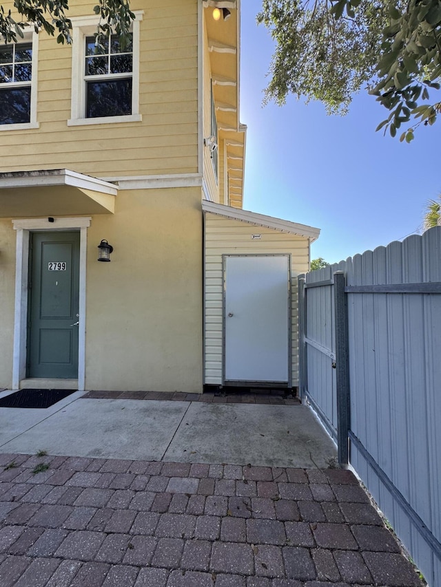 2799 Saranac Ave, West Palm Beach, FL 33409 - view of exterior entry featuring a gate