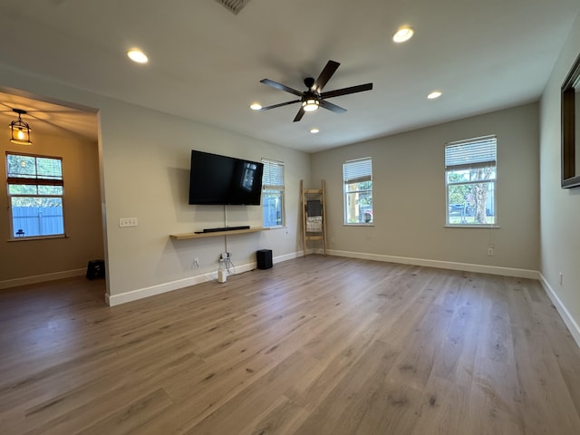 2799 Saranac Ave, West Palm Beach, FL 33409 - unfurnished living room with a ceiling fan, wood finished floors, and recessed lighting