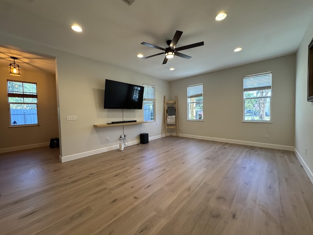 2799 Saranac Ave, West Palm Beach, FL 33409 - unfurnished living room with ceiling fan, recessed lighting, and wood finished floors