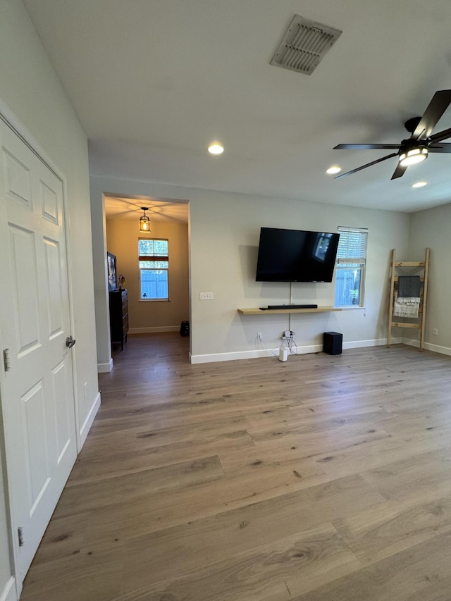 2799 Saranac Ave, West Palm Beach, FL 33409 - unfurnished living room with recessed lighting, wood finished floors, and a ceiling fan