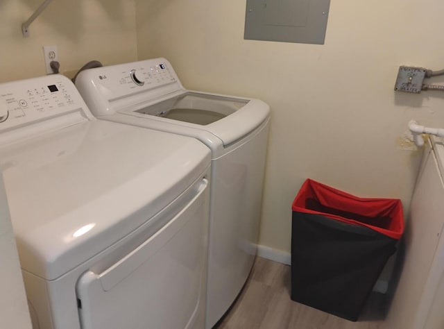 3531 Tall Pine Way Unit B-2, Greenacres, FL 33463 - laundry area featuring electric panel, washing machine and clothes dryer, and light wood-style flooring