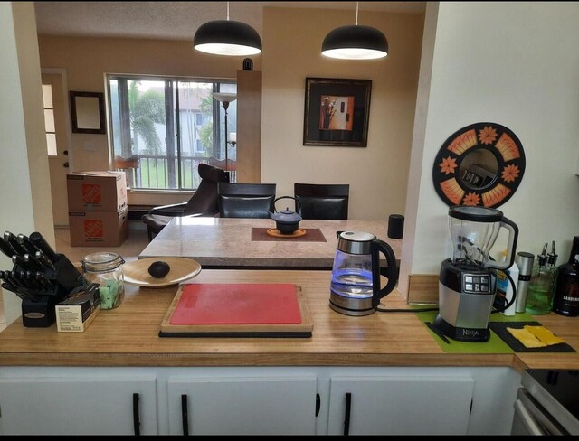 3531 Tall Pine Way Unit B-2, Greenacres, FL 33463 - kitchen with stainless steel electric stove and pendant lighting