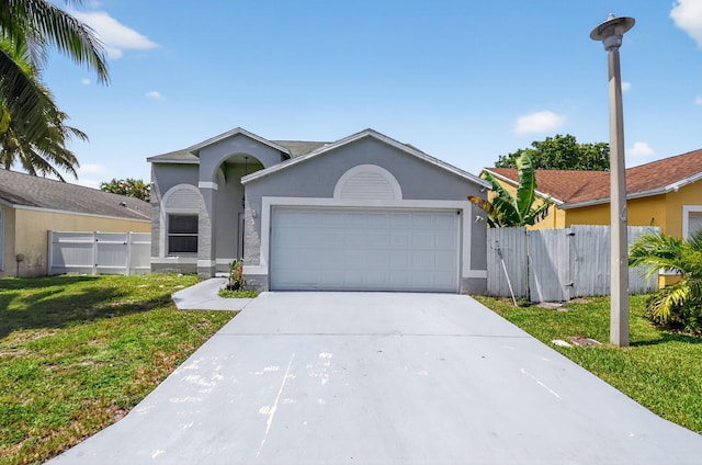 3 Ripley Way, Boynton Beach, FL 33426 - ranch-style house with stucco siding, an attached garage, concrete driveway, and a gate