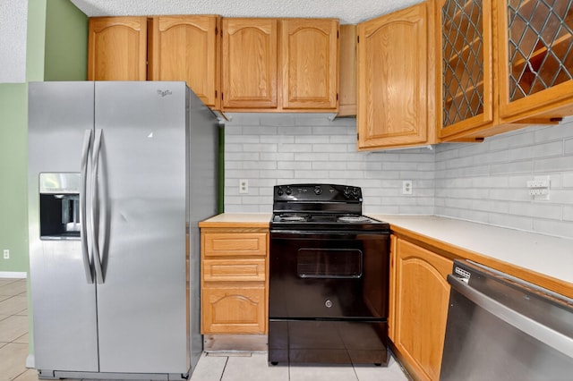 3 Ripley Way, Boynton Beach, FL 33426 - kitchen featuring appliances with stainless steel finishes, light tile patterned floors, and backsplash