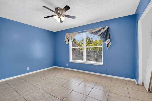 3 Ripley Way, Boynton Beach, FL 33426 - unfurnished room featuring a textured ceiling, tile patterned flooring, and a ceiling fan