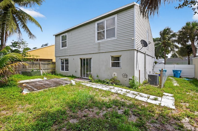3 Ripley Way, Boynton Beach, FL 33426 - back of property with a fenced backyard, stucco siding, and a deck