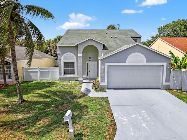 3 Ripley Way, Boynton Beach, FL 33426 - view of front facade featuring a garage, concrete driveway, stucco siding, a gate, and a shingled roof