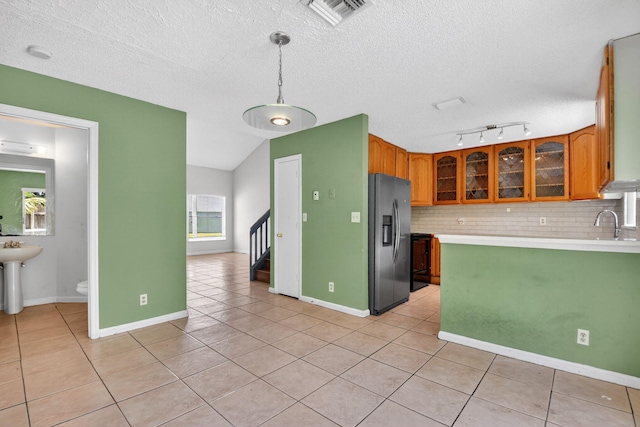 3 Ripley Way, Boynton Beach, FL 33426 - kitchen with stainless steel refrigerator with ice dispenser, light tile patterned flooring, light countertops, backsplash, and a textured ceiling
