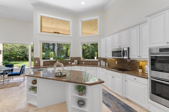 16164 Bridlewood Cir, Delray Beach, FL 33445 - kitchen featuring open shelves, appliances with stainless steel finishes, crown molding, white cabinetry, and a high ceiling