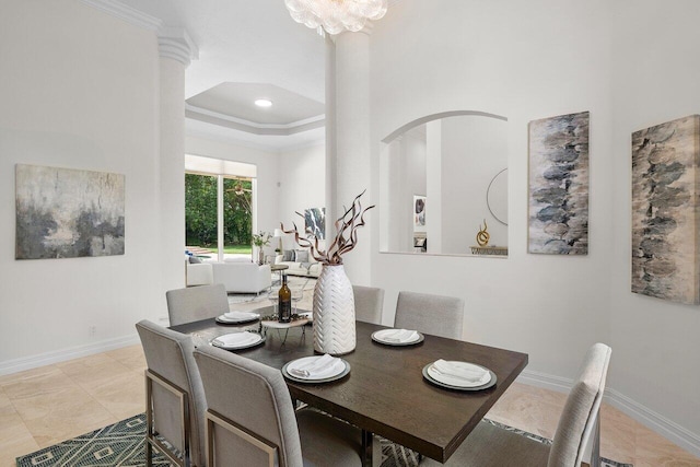 16164 Bridlewood Cir, Delray Beach, FL 33445 - dining area with baseboards, light tile patterned floors, a tray ceiling, crown molding, and a chandelier