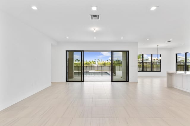 12870 Crane Xing, Palm Beach Gardens, FL 33412 - unfurnished room featuring recessed lighting and light tile patterned flooring