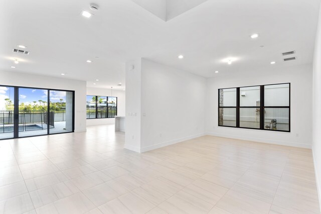 12870 Crane Xing, Palm Beach Gardens, FL 33412 - empty room featuring a smoke detector, recessed lighting, and a water view