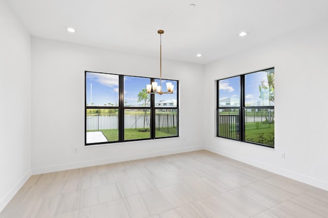 12870 Crane Xing, Palm Beach Gardens, FL 33412 - unfurnished room with a chandelier, a water view, and recessed lighting