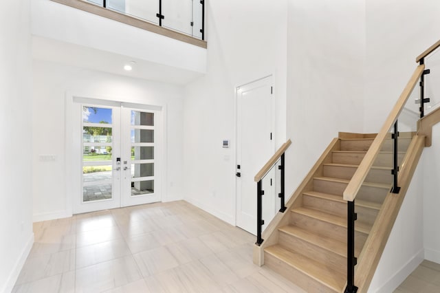 12870 Crane Xing, Palm Beach Gardens, FL 33412 - foyer featuring stairway, french doors, and a high ceiling