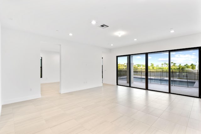 12870 Crane Xing, Palm Beach Gardens, FL 33412 - empty room with baseboards and recessed lighting