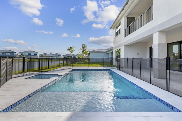 12870 Crane Xing, Palm Beach Gardens, FL 33412 - view of swimming pool with a residential view, a pool with connected hot tub, and a patio area