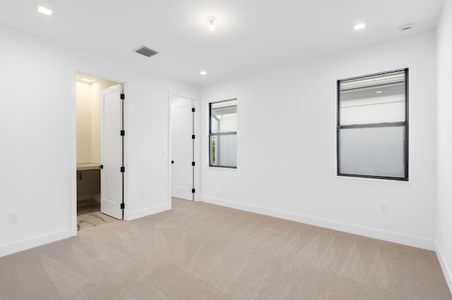 12870 Crane Xing, Palm Beach Gardens, FL 33412 - unfurnished bedroom with carpet flooring, ensuite bathroom, and recessed lighting