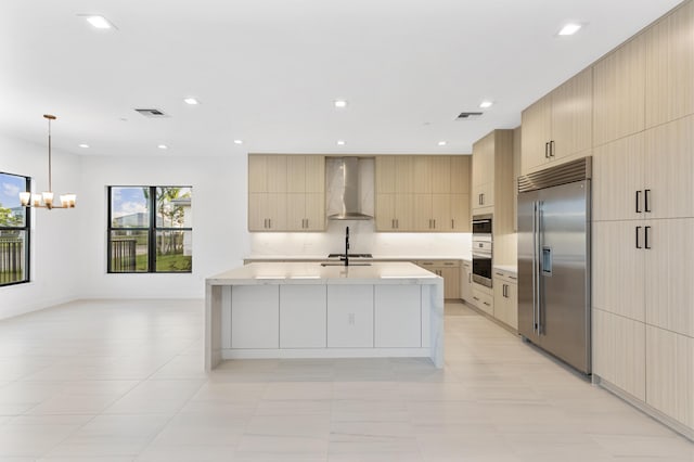 12870 Crane Xing, Palm Beach Gardens, FL 33412 - kitchen with appliances with stainless steel finishes, wall chimney range hood, modern cabinets, a chandelier, and recessed lighting