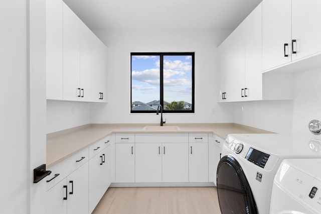 12870 Crane Xing, Palm Beach Gardens, FL 33412 - laundry area featuring washer and clothes dryer and cabinet space