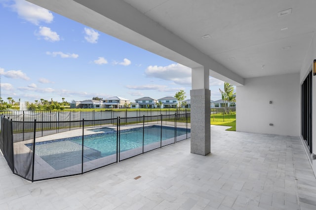 12870 Crane Xing, Palm Beach Gardens, FL 33412 - view of swimming pool with a patio, a fenced backyard, a residential view, and a pool with connected hot tub