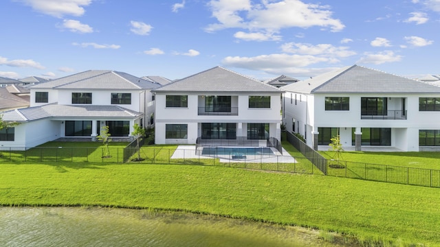 12870 Crane Xing, Palm Beach Gardens, FL 33412 - back of property with a balcony, a fenced backyard, a patio, and stucco siding