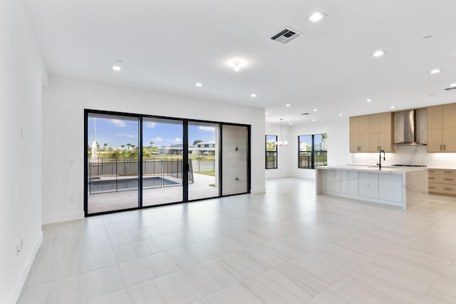 12870 Crane Xing, Palm Beach Gardens, FL 33412 - unfurnished living room with baseboards and recessed lighting