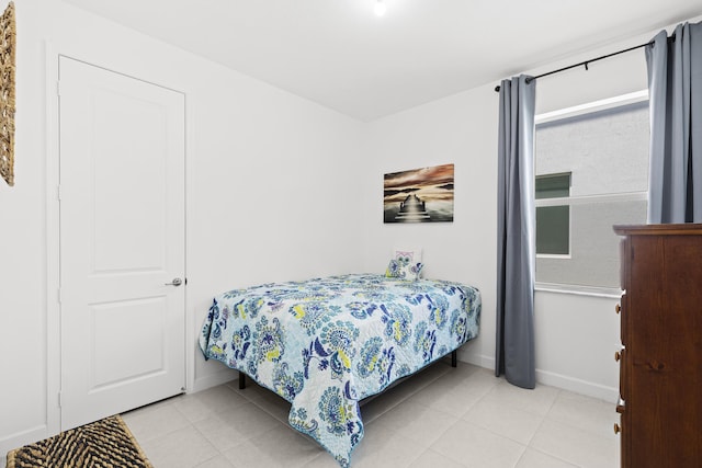 5697 Graceful Way, Delray Beach, FL 33484 - tiled bedroom featuring baseboards