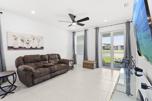 5697 Graceful Way, Delray Beach, FL 33484 - living room with a ceiling fan, light tile patterned flooring, recessed lighting, and a water view