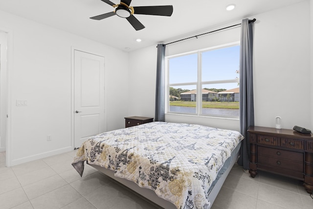 5697 Graceful Way, Delray Beach, FL 33484 - bedroom featuring light tile patterned flooring, recessed lighting, ceiling fan, and a water view