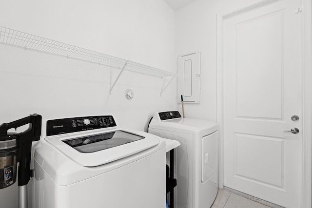 5697 Graceful Way, Delray Beach, FL 33484 - laundry room with washing machine and dryer, electric panel, and light tile patterned flooring