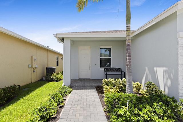 5697 Graceful Way, Delray Beach, FL 33484 - property entrance with stucco siding and a porch