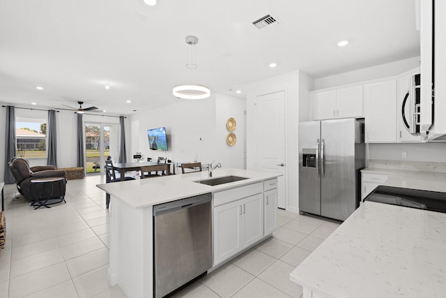 5697 Graceful Way, Delray Beach, FL 33484 - kitchen featuring stainless steel appliances, light tile patterned floors, recessed lighting, open floor plan, and a ceiling fan