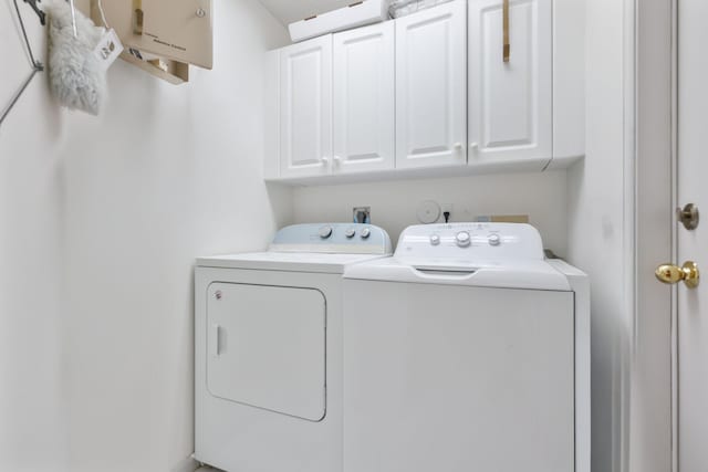 1350 SW 18th St, Boca Raton, FL 33486 - washroom with cabinet space and independent washer and dryer