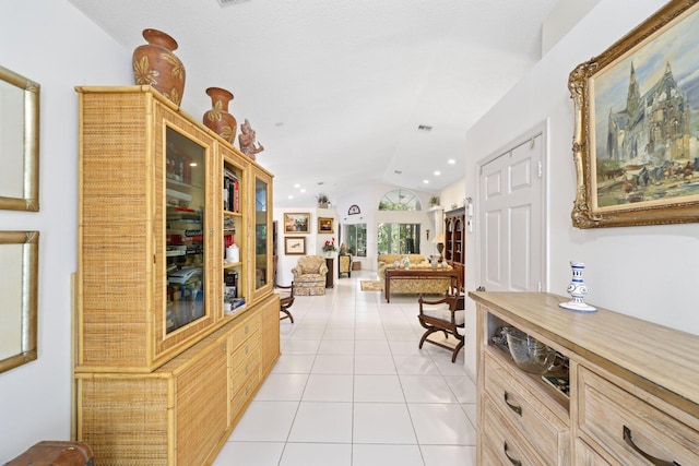 1350 SW 18th St, Boca Raton, FL 33486 - hallway featuring light tile patterned floors, vaulted ceiling, and recessed lighting