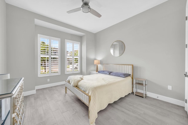 15187 Goldfinch Cir, Westlake, FL 33470 - bedroom featuring light wood-style flooring and a ceiling fan
