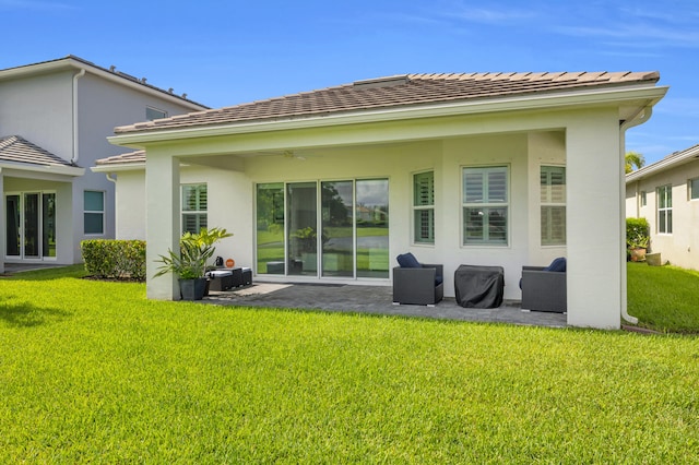 15187 Goldfinch Cir, Westlake, FL 33470 - rear view of property featuring a patio, a yard, stucco siding, and ceiling fan