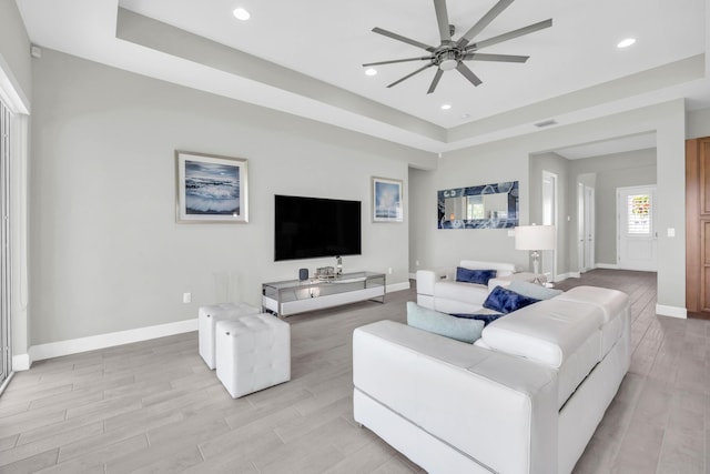 15187 Goldfinch Cir, Westlake, FL 33470 - living area with a raised ceiling, light wood-type flooring, ceiling fan, and recessed lighting
